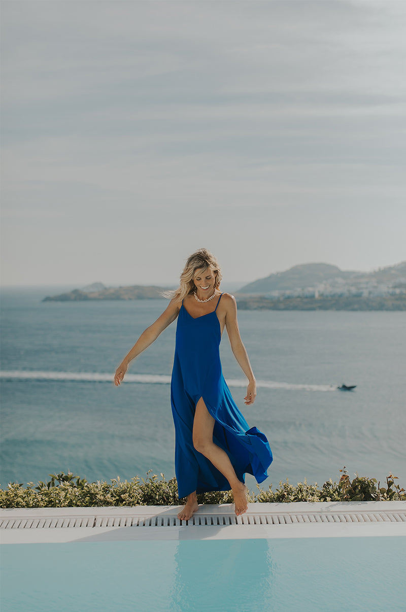 Blonde Model wearing the lady & the sailor Chloe Dress in Cobalt.