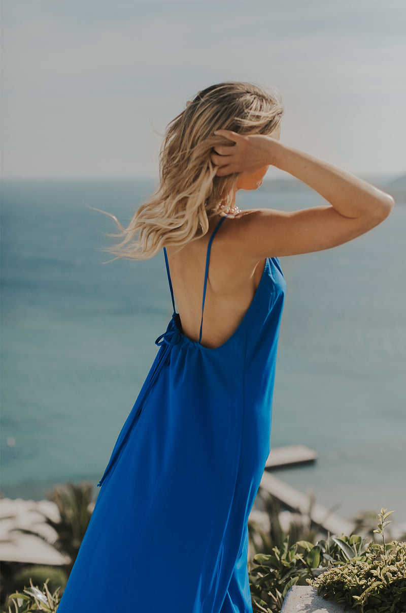 Blonde Model wearing the lady & the sailor Chloe Dress in Cobalt.