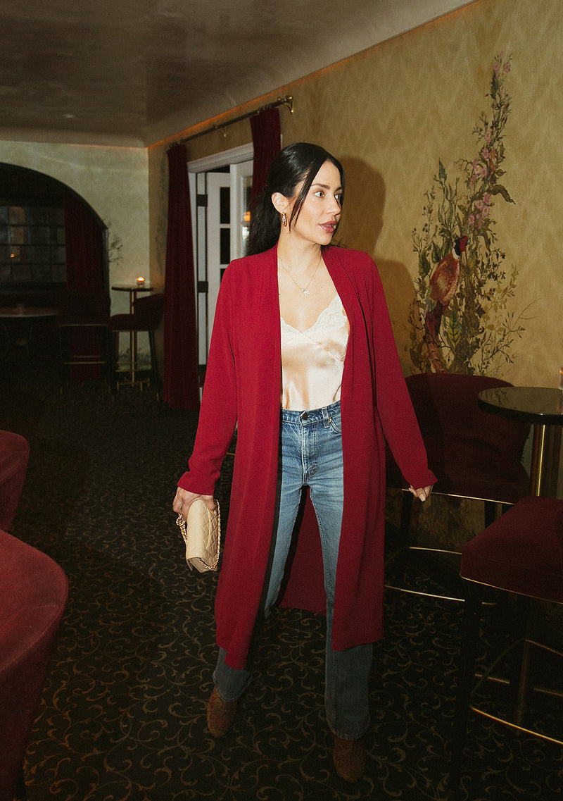 Brunette Model wearing the lady & the sailor Midi Duster Coat in Ruby Air Flow.