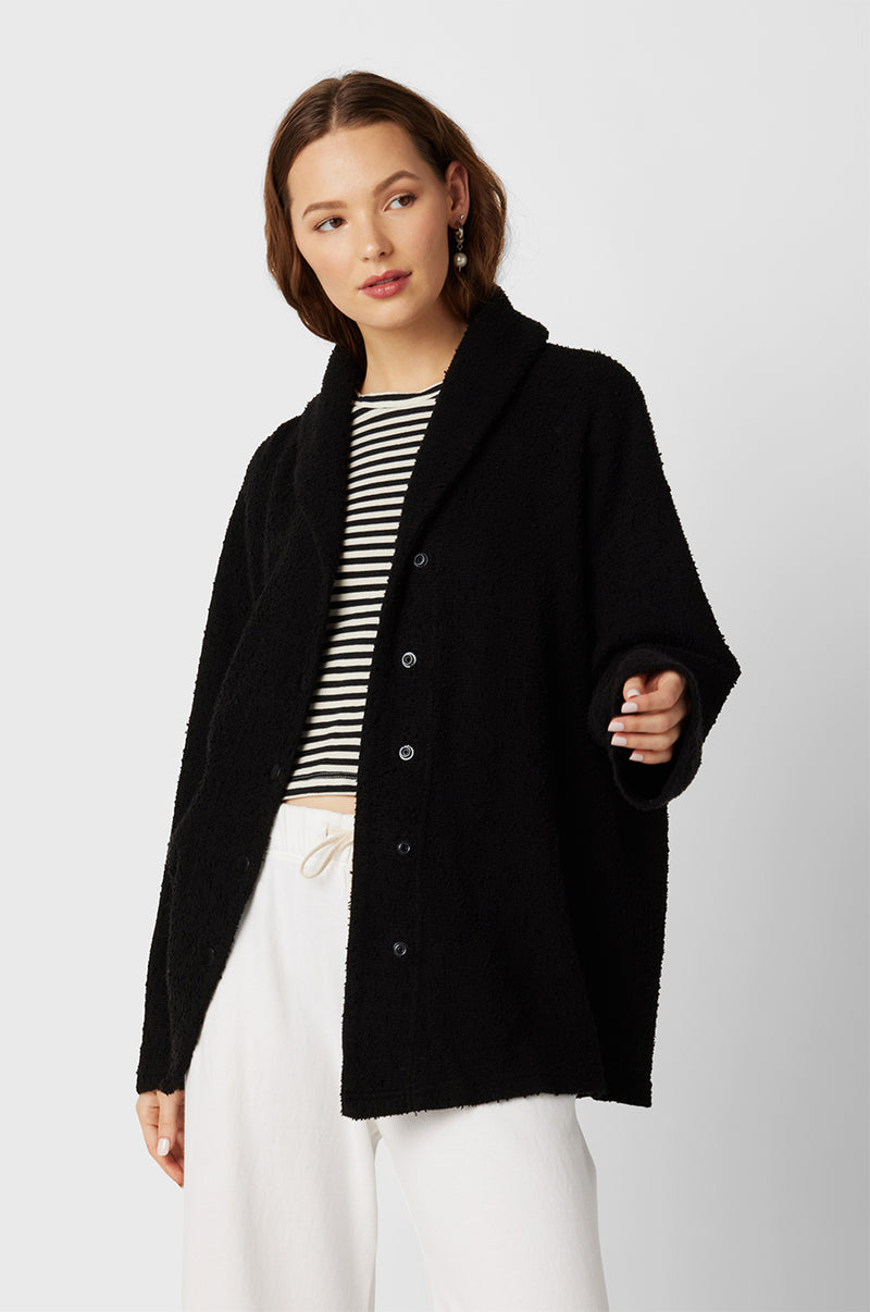 Model wearing the lady & the sailor Snap Cardi in Black Bouclé.