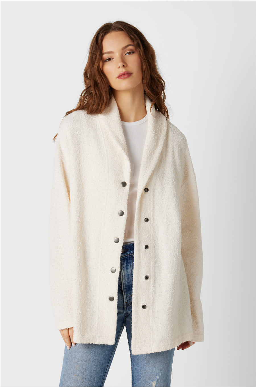 Brunette Model wearing the lady & the sailor Snap Cardi in Vanilla Boucle.
