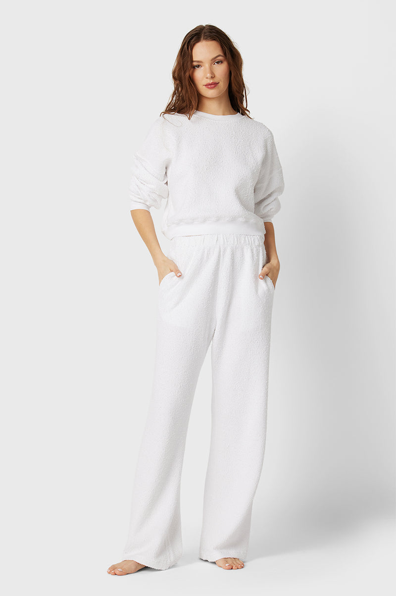Brunette Model wearing the lady & the sailor Straight Leg Sweatpant in White Bouclé.