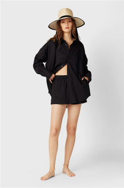 Brunette Model wearing the lady & the sailor The Sunday Shirt in Black Poplin.