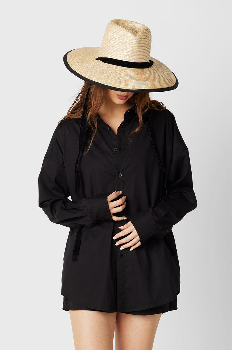 Brunette Model wearing the lady & the sailor The Sunday Shirt in Black Poplin.