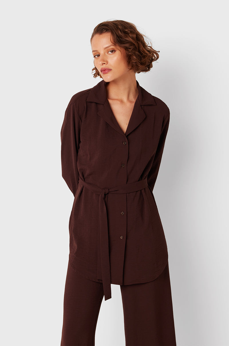Brunette Model wearing the lady & the sailor Belted Button Up in Chocolate Air Flow.