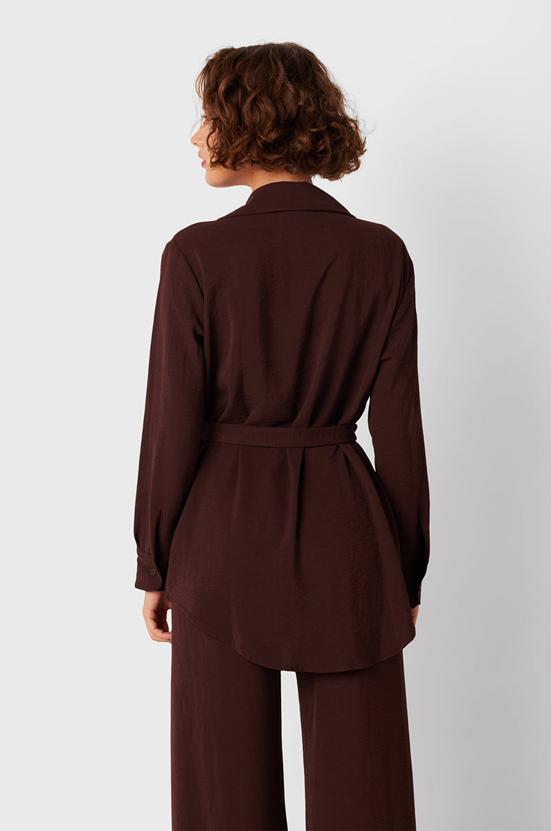 Brunette Model wearing the lady & the sailor Belted Button Up in Chocolate Air Flow.