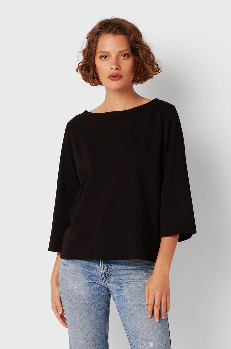 Brunette Model wearing the lady & the sailor Breton Tee in Black Vintage Cotton.