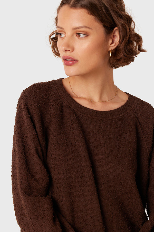 Brunette Model wearing the lady & the sailor Brentwood Sweatshirt in Chocolate Bouclé.