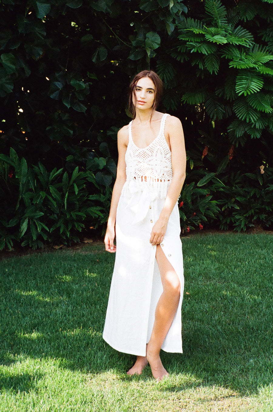Model wearing the lady & the sailor Crochet Fringe Tank in white.