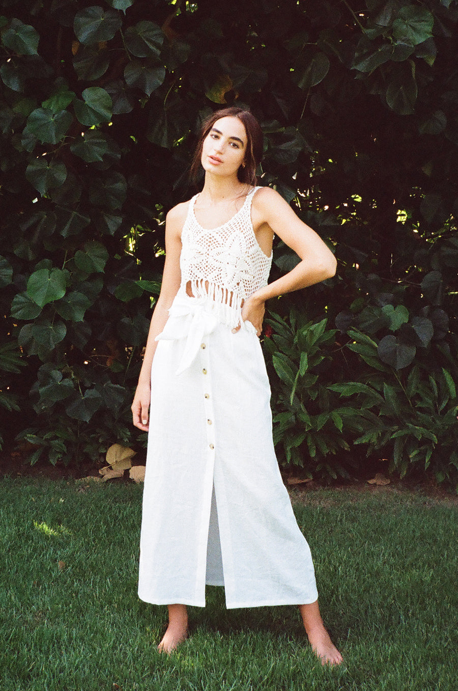 Model wearing the lady & the sailor Crochet Fringe Tank in white.