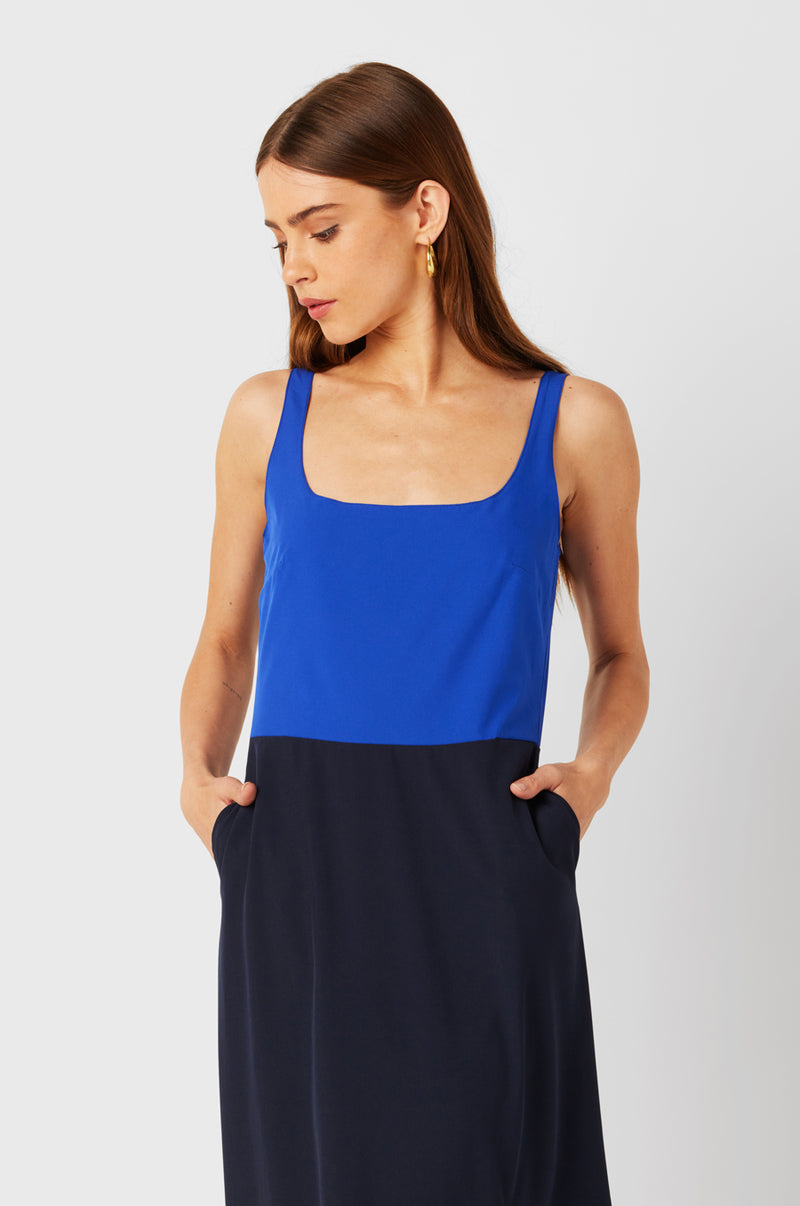 Brunette Model wearing the lady & the sailor Charlie Dress in Cobalt & Navy.