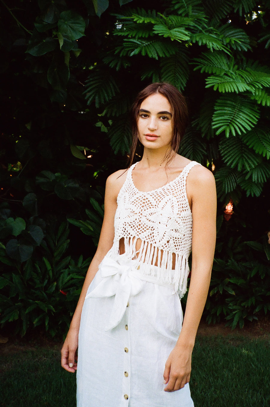 Model wearing the lady & the sailor Crochet Fringe Tank in white.