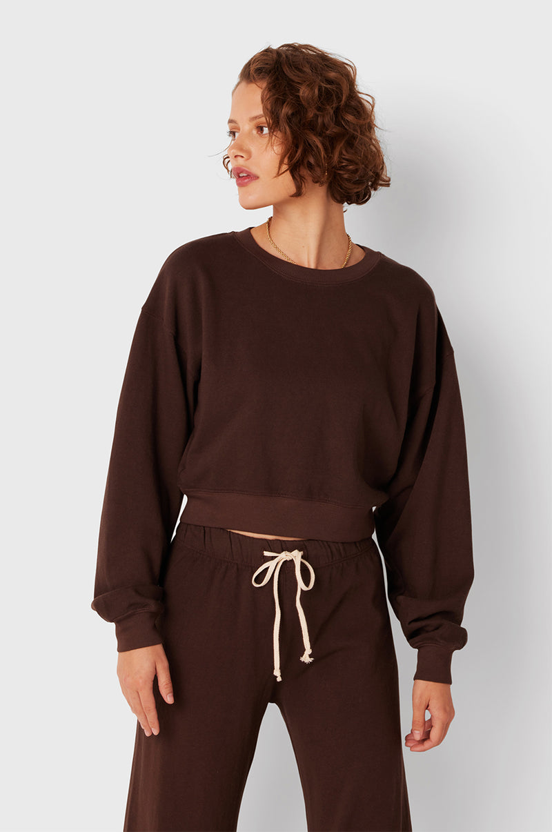 Brunette Model wearing the lady & the sailor Cropped Sweatshirt in Chocolate Organic Cotton.
