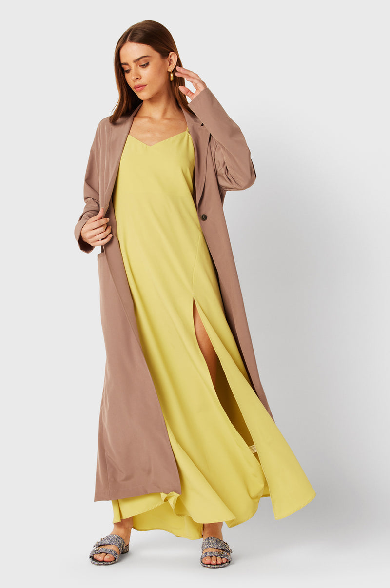 Brunette Model wearing the lady & the sailor The Duster in Dusk.