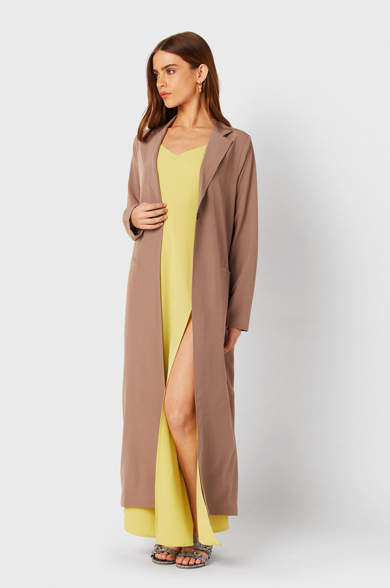 Brunette Model wearing the lady & the sailor The Duster in Dusk.