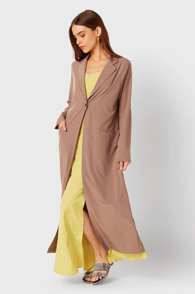 Brunette Model wearing the lady & the sailor The Duster in Dusk.