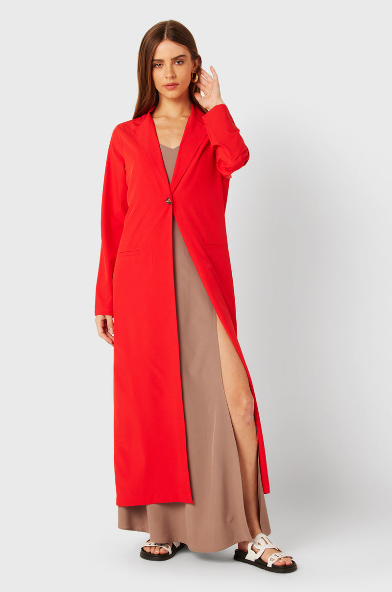 Brunette Model wearing the lady & the sailor The Duster in Geranium.