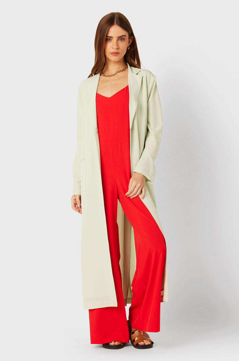 Brunette Model wearing the lady & the sailor Relaxed Jumpsuit in Geranium.