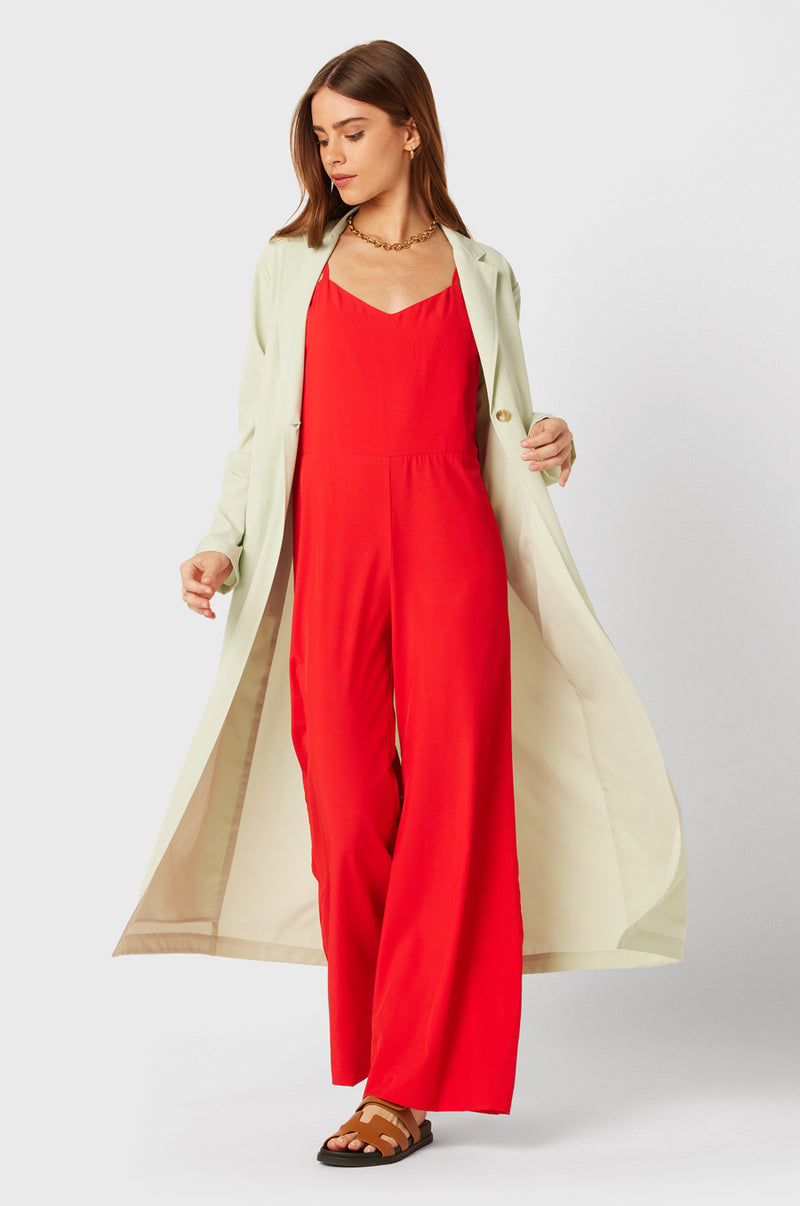 Brunette Model wearing the lady & the sailor Relaxed Jumpsuit in Geranium.