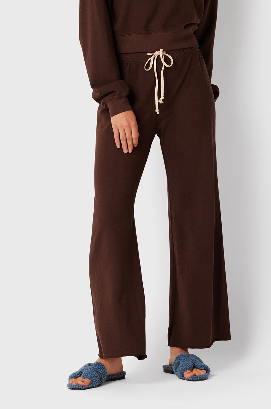 Brunette Model wearing the lady & the sailor French Flare Pant in Chocolate Organic Cotton.