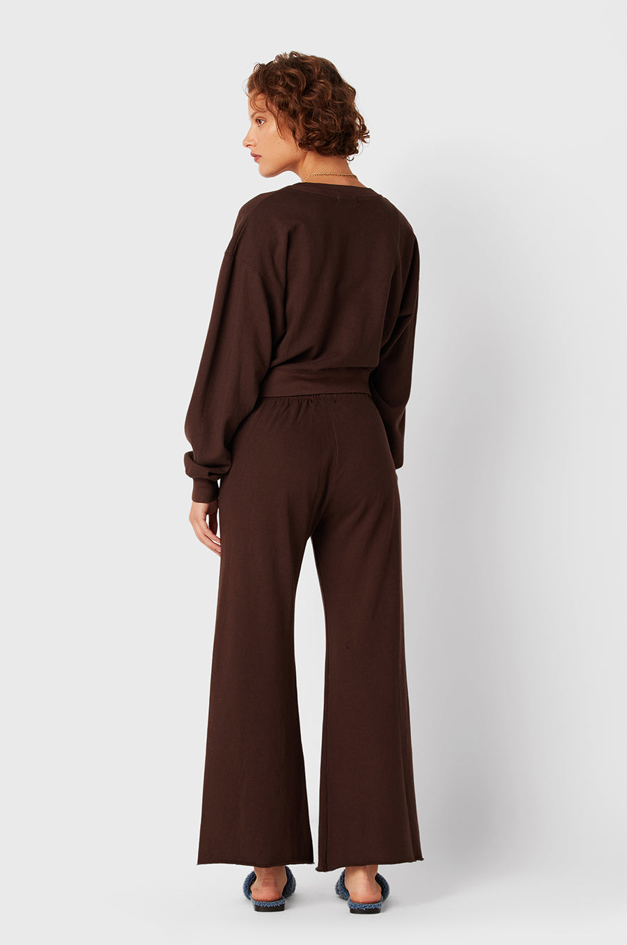 Brunette Model wearing the lady & the sailor French Flare Pant in Chocolate Organic Cotton.