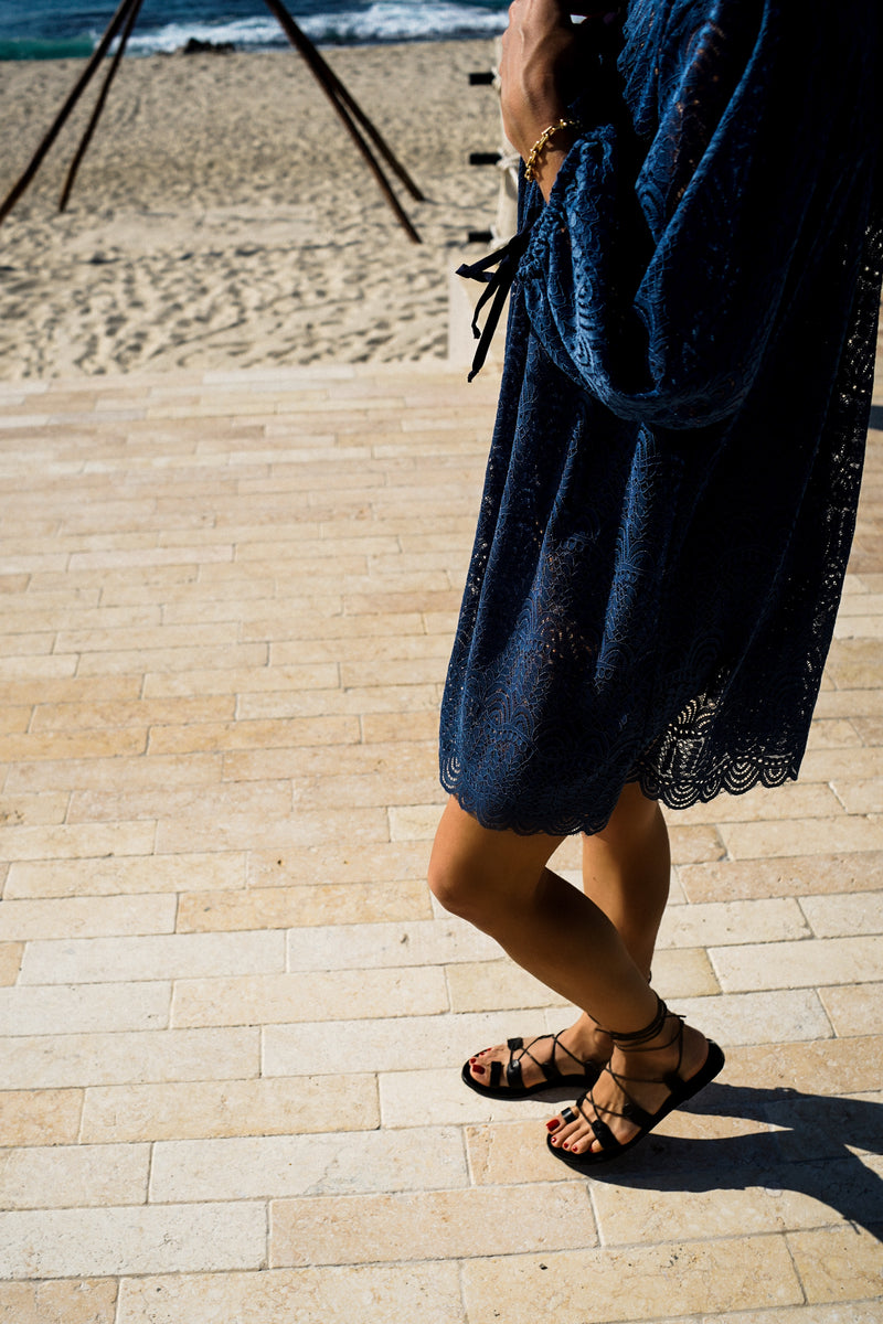 Modeling wearing Billow Sleeve Tunic Mini Dress in Indigo Lace.
