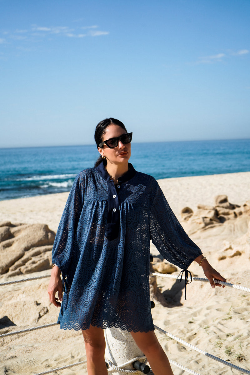 Model wearing Billow Sleeve Tunic Mini Dress in indigo lace.