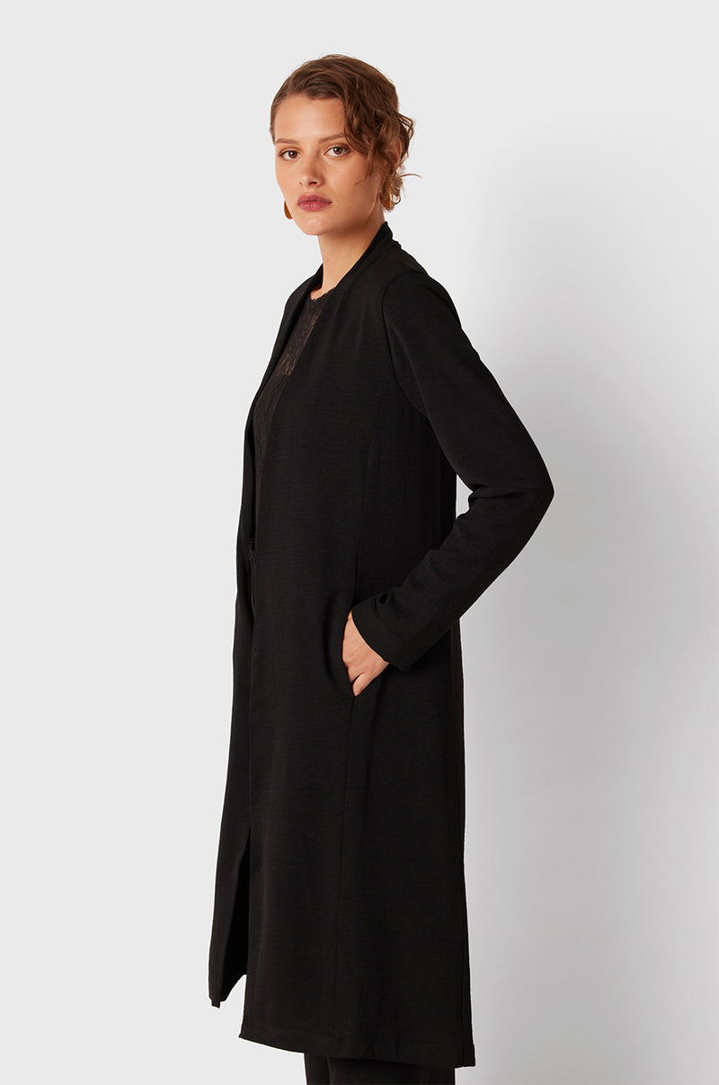 Brunette Model wearing the lady & the sailor Smock Band Pants in Black Air Flow.