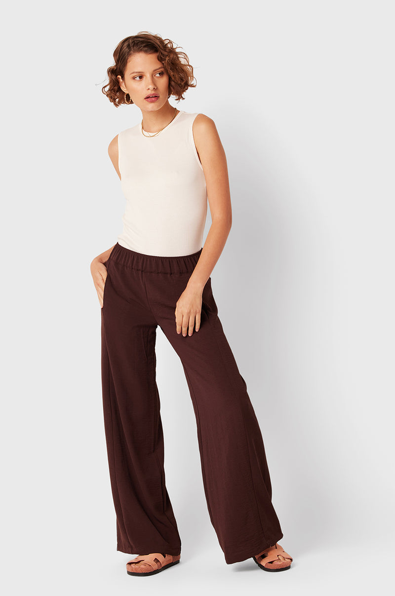 Brunette Model wearing the lady & the sailor Palazzo Pant in Chocolate Air Flow.