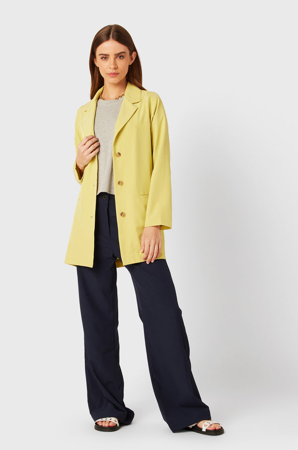 Brunette Model wearing the lady & the sailor Relaxed Blazer in Citrine.