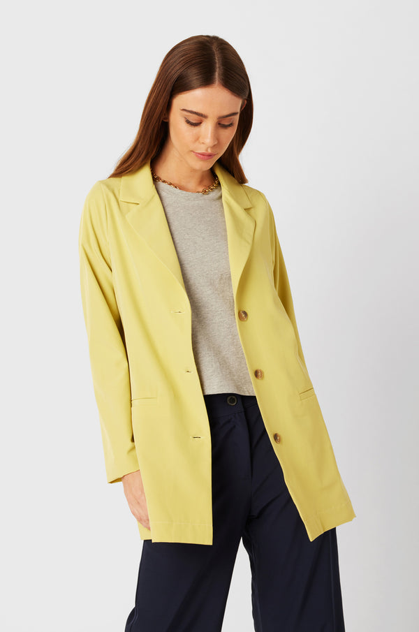 Brunette Model wearing the lady & the sailor Relaxed Blazer in Citrine.