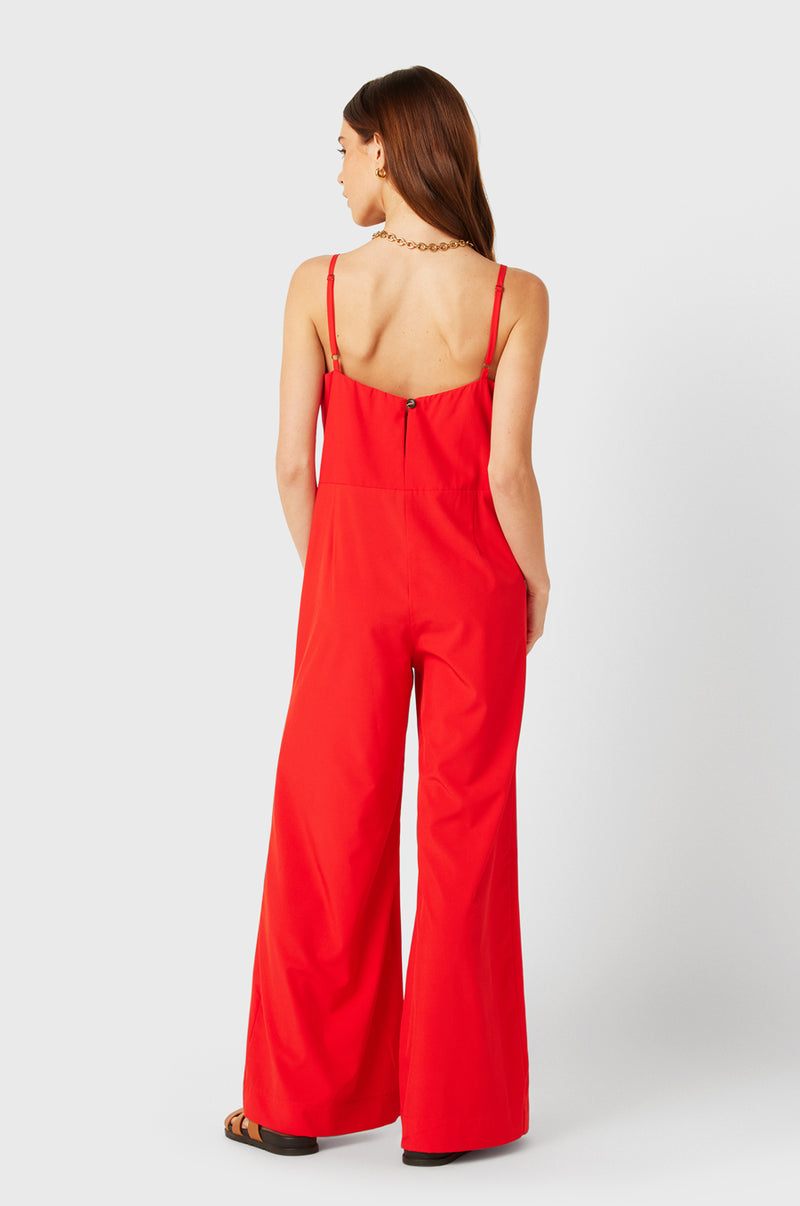 Brunette Model wearing the lady & the sailor Relaxed Jumpsuit in Geranium.