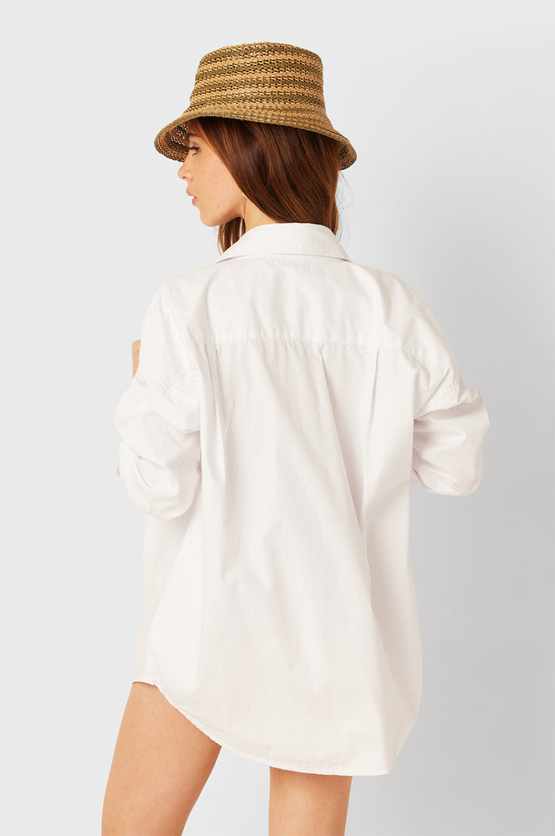 Brunette Model wearing the lady & the sailor The Sunday Shirt in White Poplin.