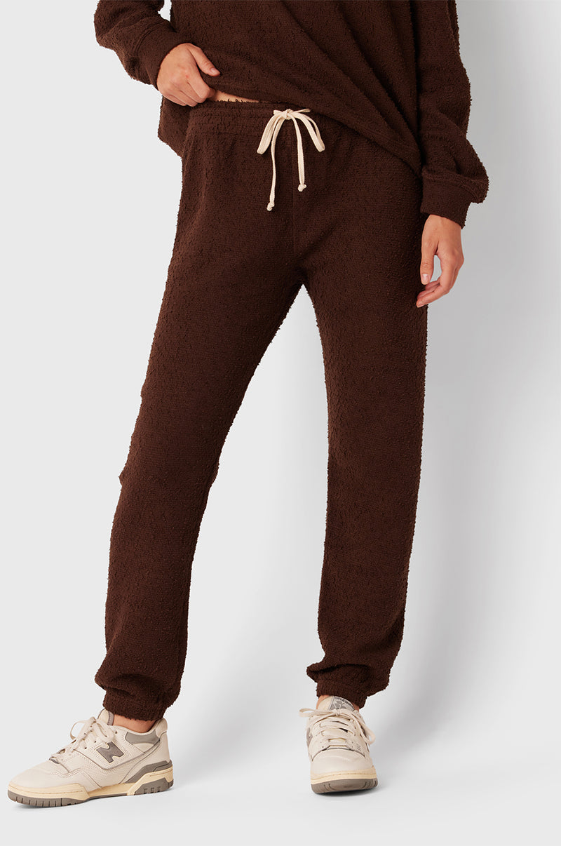 Brunette Model wearing the lady & the sailor Brentwood Sweatshirt in Chocolate Bouclé.