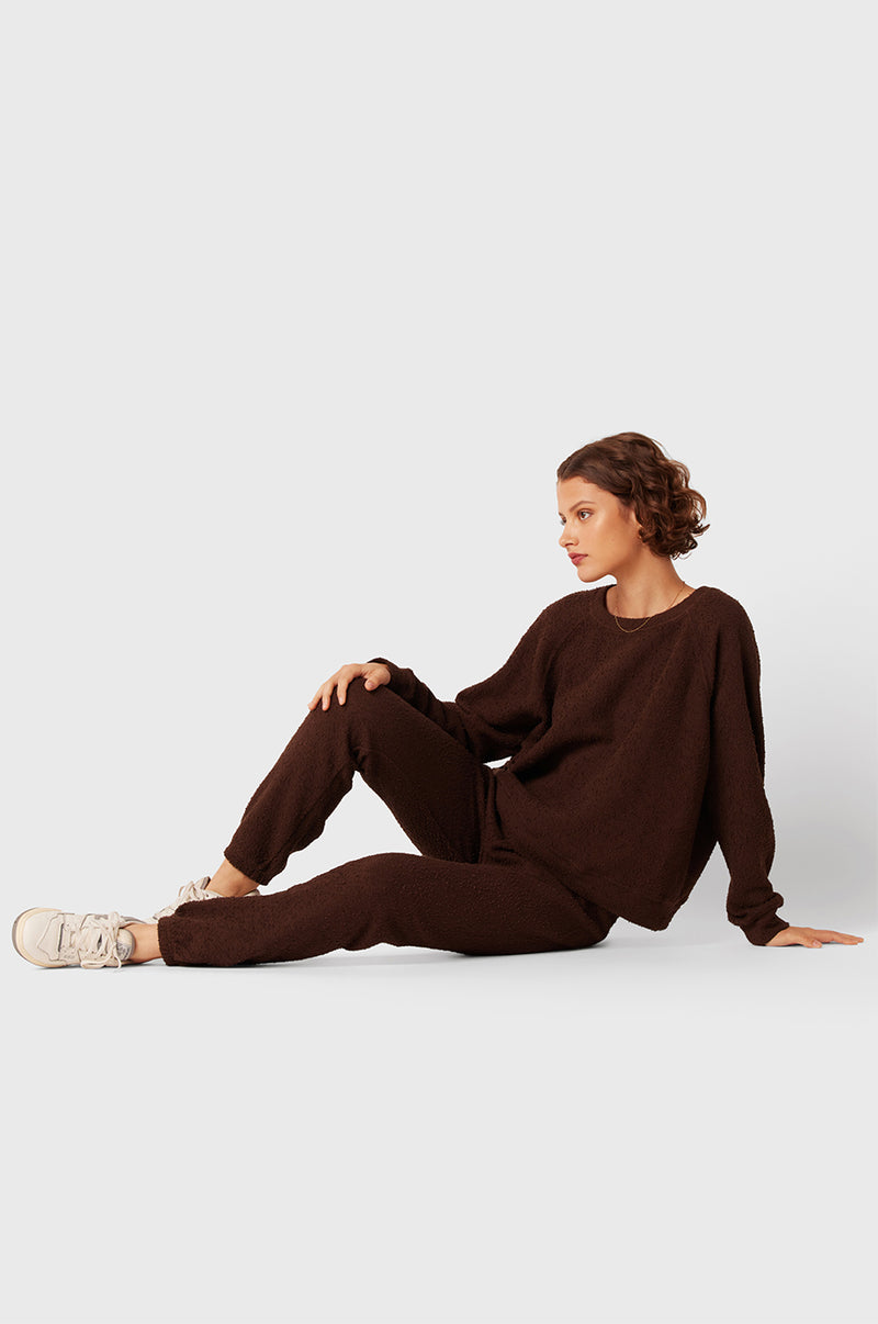 Brunette Model wearing the lady & the sailor Full Length Vintage Sweatpant in Chocolate Bouclé.