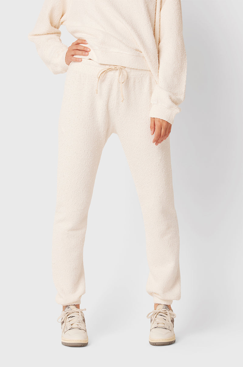 Brunette Model wearing the lady & the sailor Full Length Vintage Sweatpant in Vanilla Bouclé.