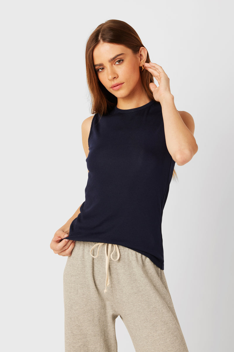 Brunette Model wearing the lady & the sailor Tomboy Tank in Navy Classic Rib.