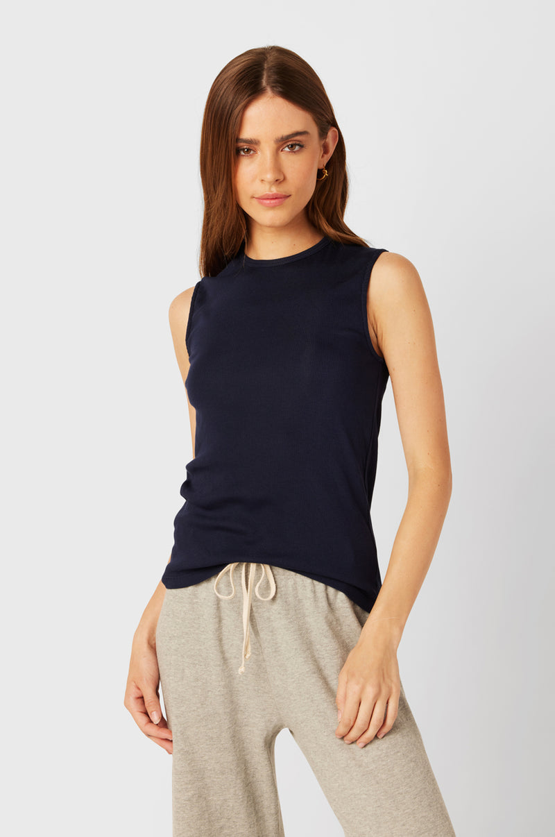 Brunette Model wearing the lady & the sailor Tomboy Tank in Navy Classic Rib.