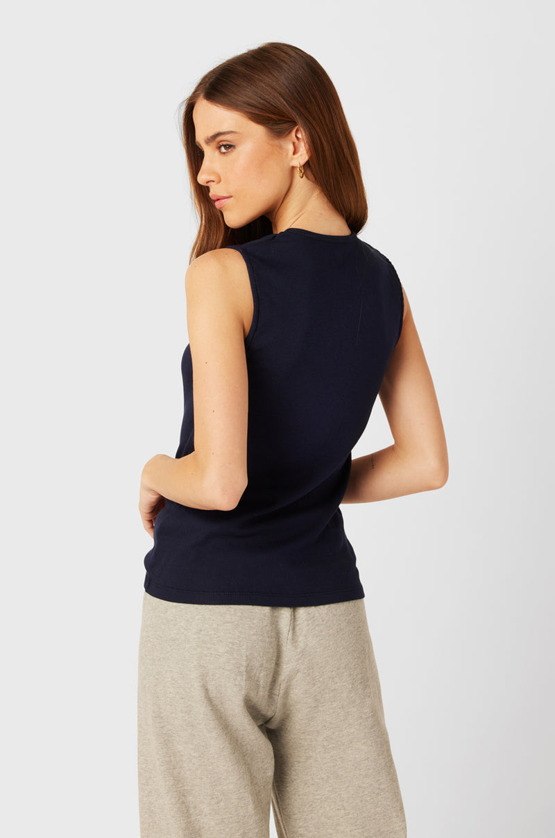 Brunette Model wearing the lady & the sailor Tomboy Tank in Navy Classic Rib.