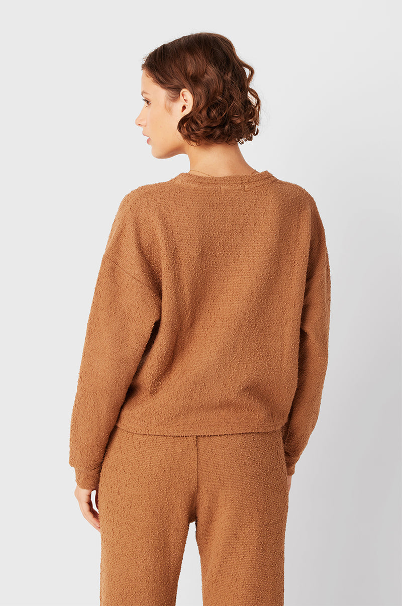 Brunette Model wearing the lady & the sailor Full Length Vintage Sweatpant in Caramel Bouclé.